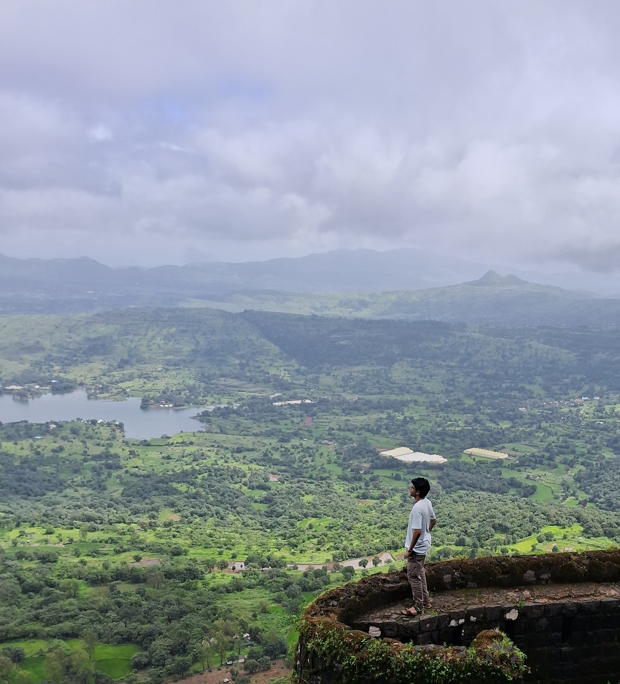 Jayant Potdar overlooking Sahyadri mountain valley from historic fort bastion